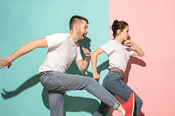 Image showing A couple of young man and woman dancing hip-hop at studio.