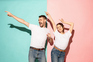 Image showing A couple of young man and woman dancing hip-hop at studio.