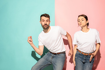 Image showing A couple of young man and woman dancing hip-hop at studio.