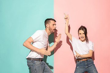 Image showing A couple of young man and woman dancing hip-hop at studio.