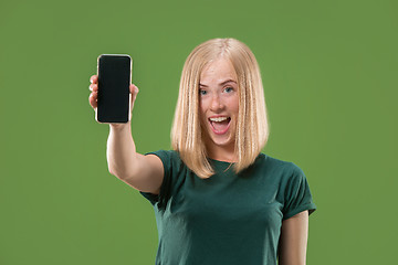 Image showing Portrait of a confident casual girl showing blank screen mobile phone