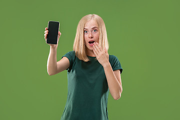 Image showing Portrait of a confident casual girl showing blank screen mobile phone