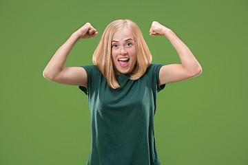 Image showing Winning success woman happy ecstatic celebrating being a winner. Dynamic energetic image of female model