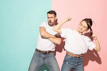 Image showing A couple of young man and woman dancing hip-hop at studio.