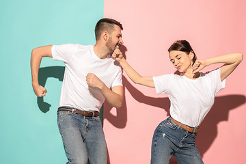 Image showing A couple of young man and woman dancing hip-hop at studio.
