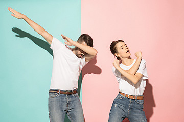 Image showing A couple of young man and woman dancing hip-hop at studio.