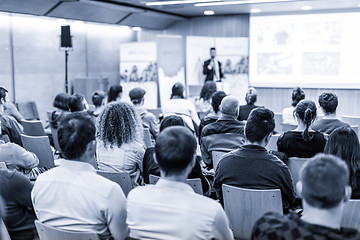 Image showing Business speaker giving a talk at business conference event.