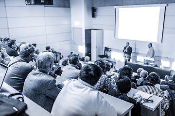 Image showing Business speaker giving a talk at business conference event.