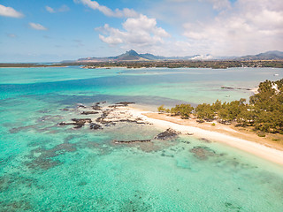 Image showing Aerial view of beautiful tropical beach with turquoise sea. Tropical vacation paradise destination of D\'eau Douce and Ile aux Cerfs Mauritius