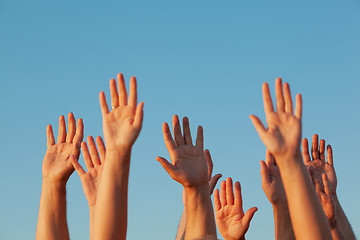 Image showing Ten raised hands