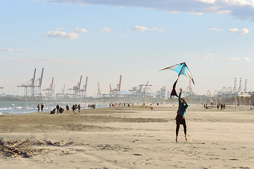 Image showing Flying a kite on winter beach