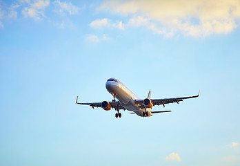 Image showing Flying airplain over blue sky