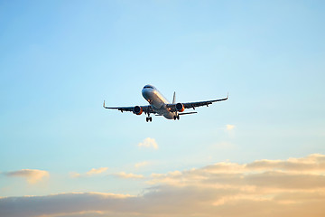 Image showing Flying airplain over blue sky