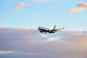 Image showing Ryanair airplane flying at sunset