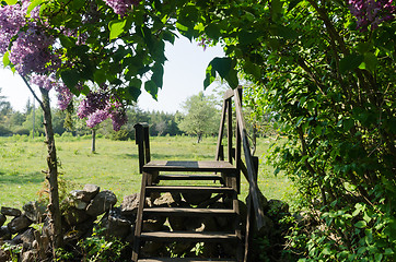 Image showing Wooden stile crossing a dry stone wall in a rural landscape by s