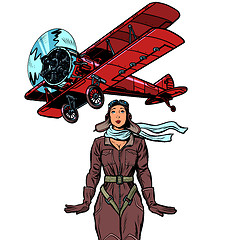 Image showing woman pilot of a vintage biplane airplane. isolate on white background