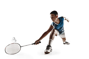 Image showing Little boy playing badminton isolated on white studio background