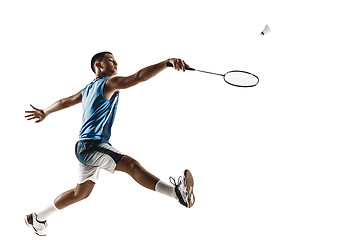 Image showing Little boy playing badminton isolated on white studio background