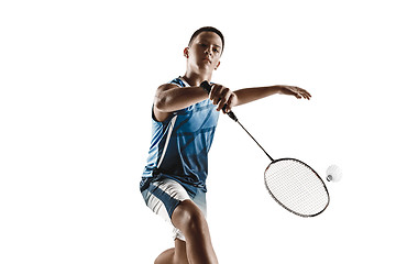 Image showing Little boy playing badminton isolated on white studio background