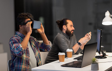 Image showing creative man in virtual reality headset at office