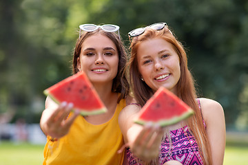 Image showing teenage girls eating watermelon at picnic in park