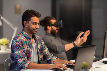 Image showing creative man with laptop working at office