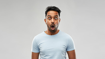 Image showing shocked or scared man over grey background