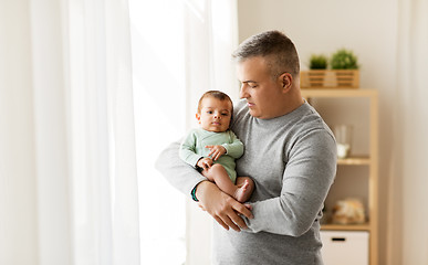 Image showing happy father holding with little baby son at home