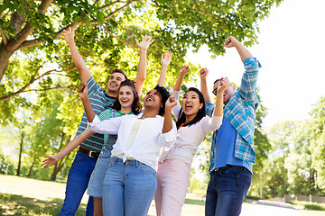 Image showing group of happy smiling friends having fun outdoors