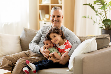 Image showing happy father with preteen and baby son at home