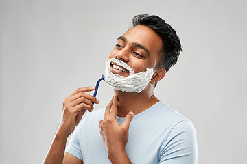 Image showing indian man shaving beard with razor blade