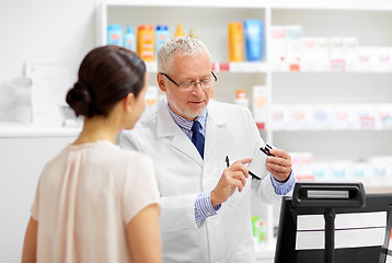 Image showing apothecary with cure and customer at pharmacy