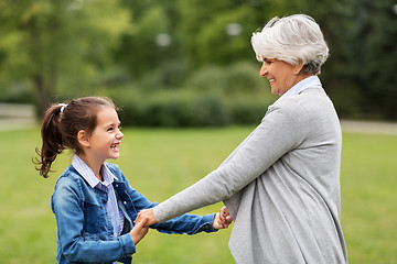 Image showing grandmother and granddaughter playing at park