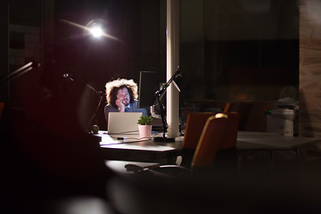 Image showing businessman relaxing at the desk