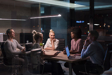 Image showing Multiethnic startup business team in night office