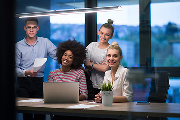 Image showing Multiethnic startup business team in night office