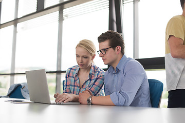 Image showing Two Business People Working With laptop in office