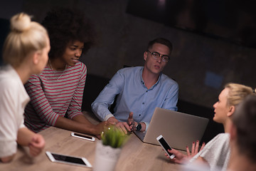 Image showing Multiethnic startup business team in night office