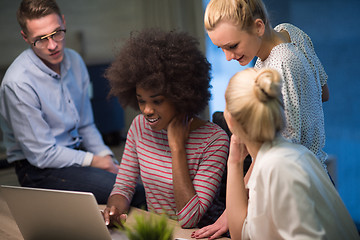 Image showing Multiethnic startup business team in night office