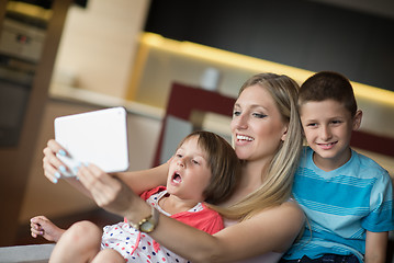 Image showing Young Family Using A Tablet To Make Future Plans