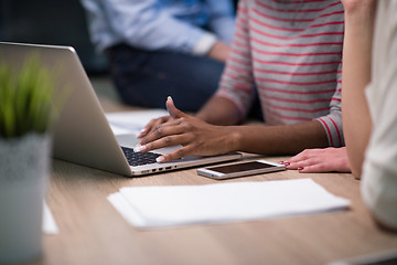 Image showing Multiethnic startup business team in night office