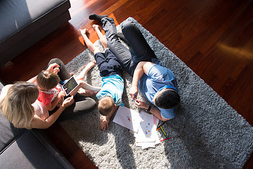 Image showing young couple spending time with kids top view