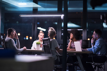 Image showing Multiethnic startup business team in night office