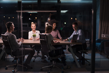 Image showing Multiethnic startup business team in night office