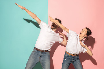 Image showing A couple of young man and woman dancing hip-hop at studio.