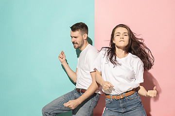 Image showing A couple of young man and woman dancing hip-hop at studio.