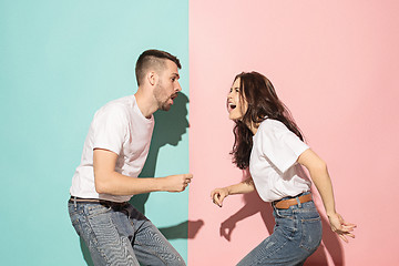 Image showing A couple of young man and woman dancing hip-hop at studio.