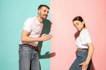 Image showing A couple of young man and woman dancing hip-hop at studio.