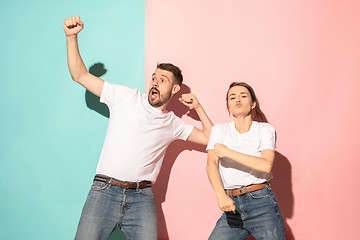 Image showing A couple of young man and woman dancing hip-hop at studio.