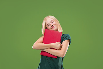 Image showing Businesswoman hugging laptop. Love to computer concept. Attractive female half-length front portrait